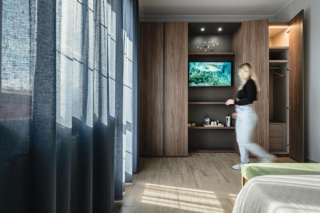 TV a/nebo společenská místnost v ubytování B&B La Perla