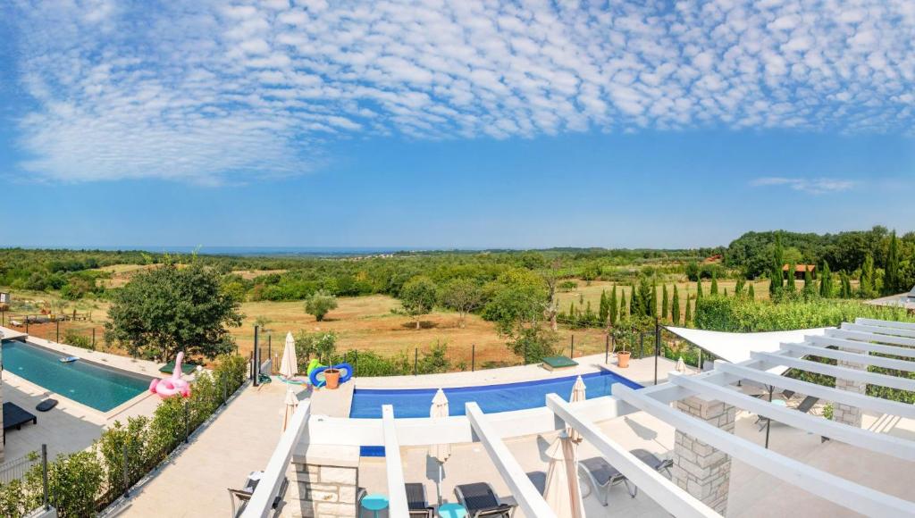 an overhead view of a swimming pool in a resort at Beautiful Villa Fior di Lavanda in Visnjan in Štuti