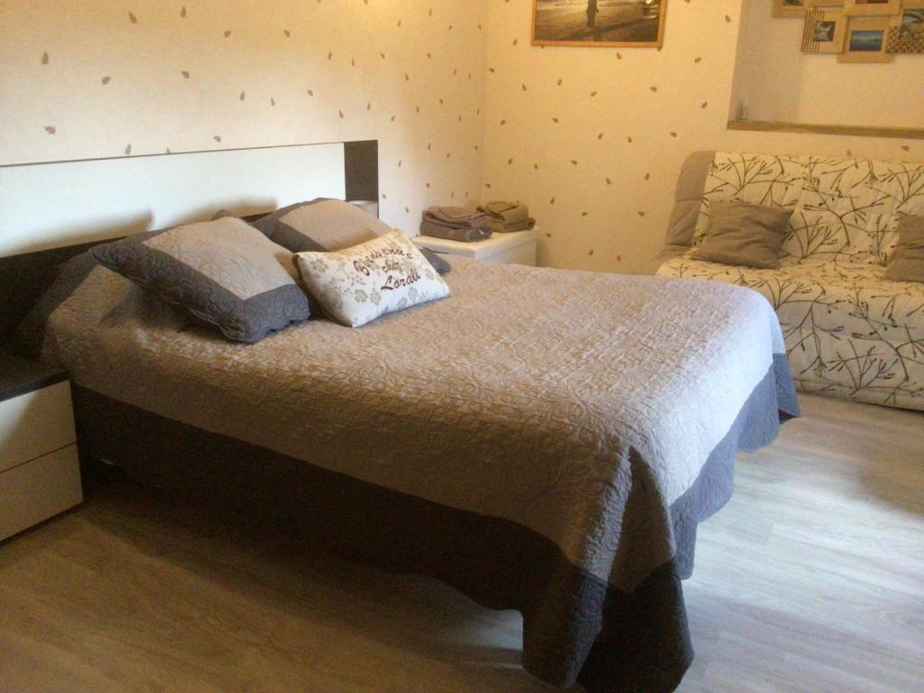 a bedroom with a bed with two pillows on it at Lorali in Gohier