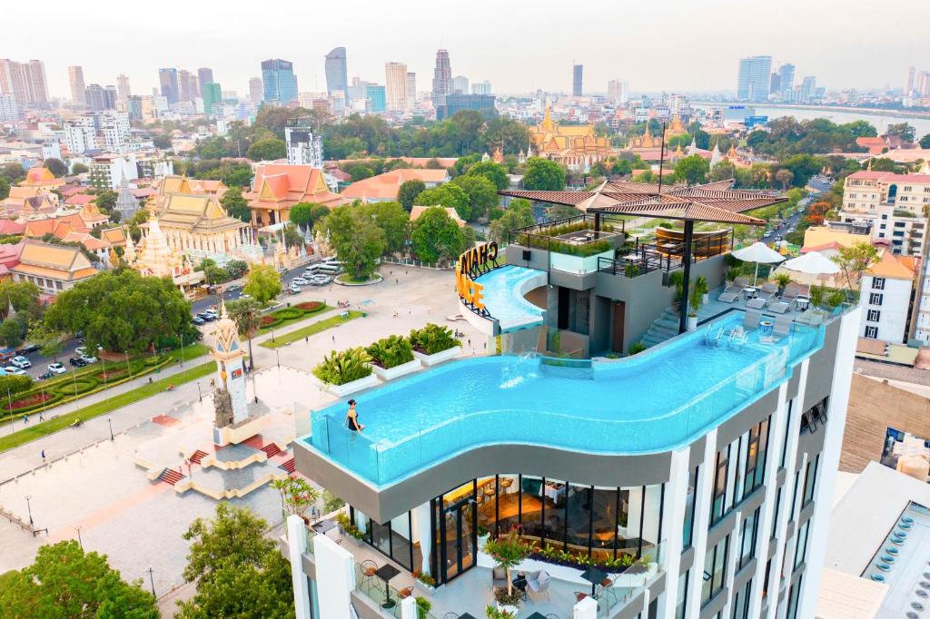 an aerial view of a building with a swimming pool at Chaiya Palace Hotel in Phnom Penh