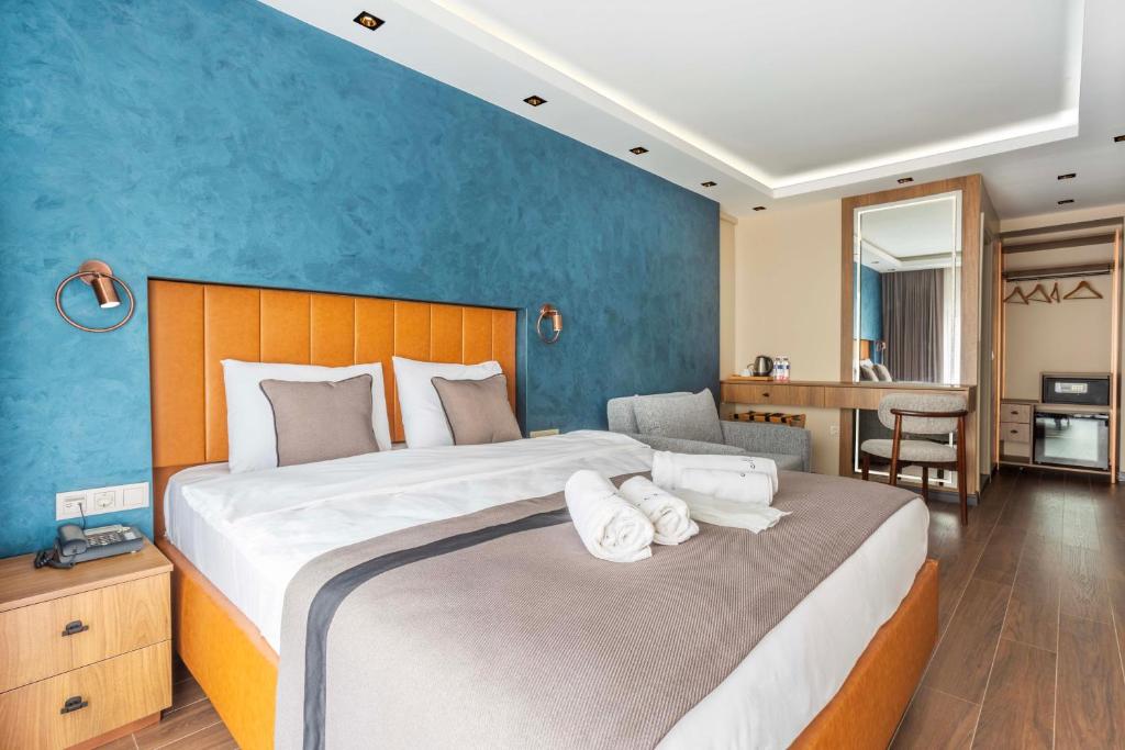Postel nebo postele na pokoji v ubytování Marlon Hotel