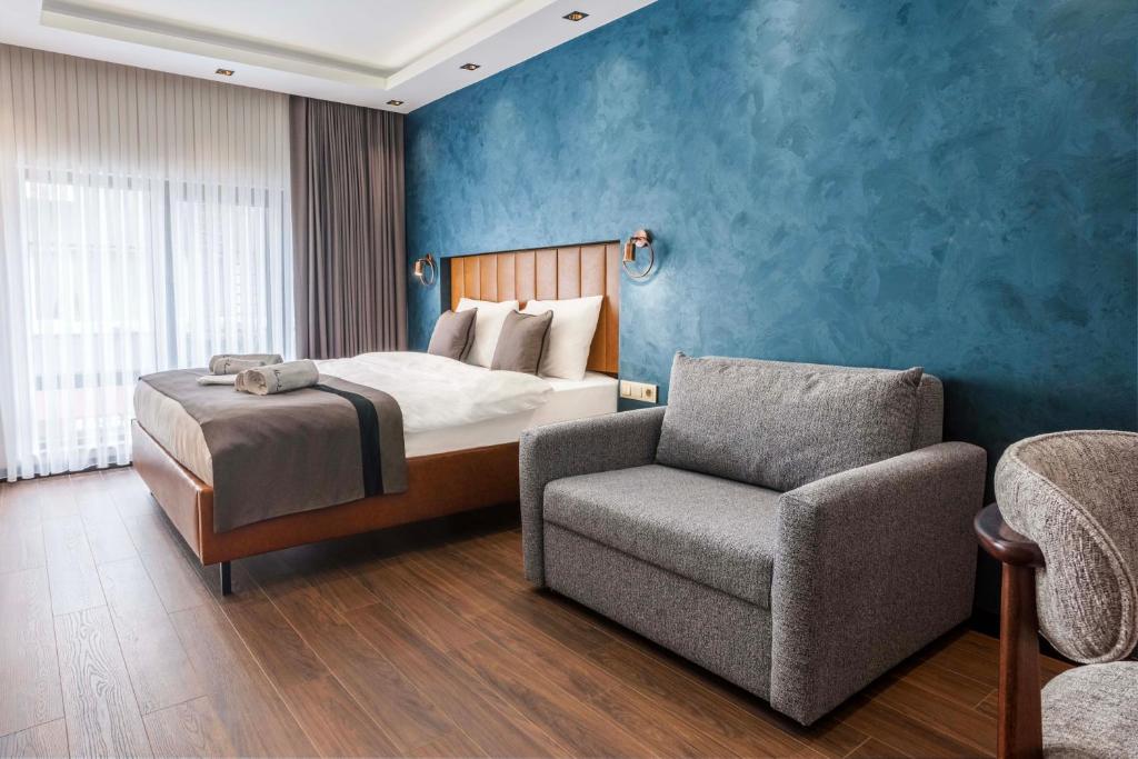Postel nebo postele na pokoji v ubytování Marlon Hotel