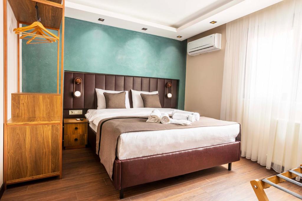 Postel nebo postele na pokoji v ubytování Marlon Hotel