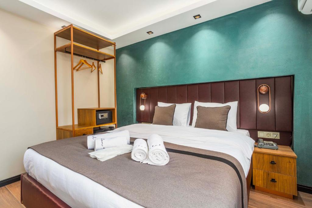Postel nebo postele na pokoji v ubytování Marlon Hotel