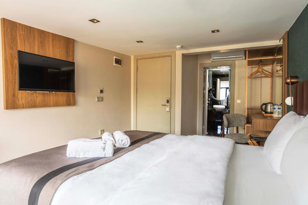 Postel nebo postele na pokoji v ubytování Marlon Hotel