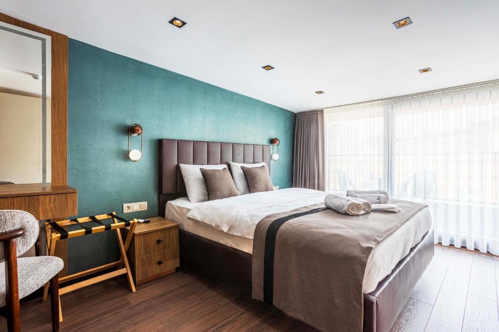 Postel nebo postele na pokoji v ubytování Marlon Hotel