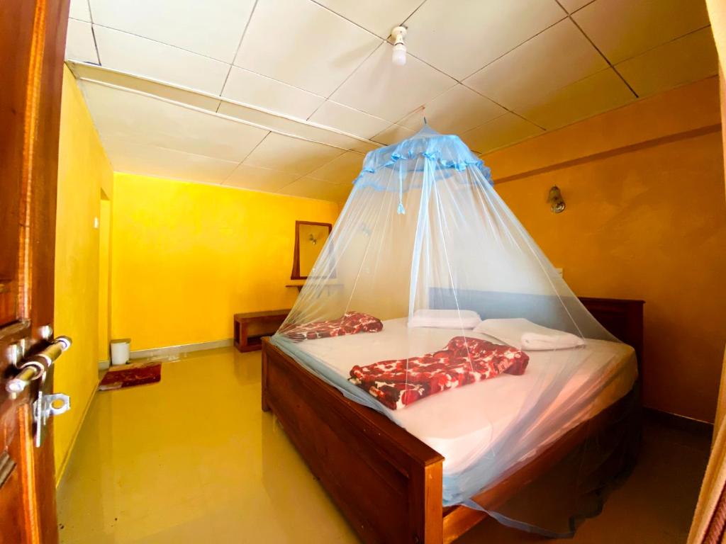 Postel nebo postele na pokoji v ubytování Omi Relax Inn