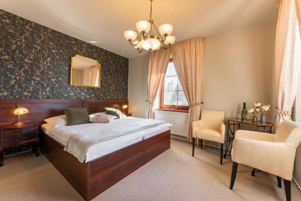 Postel nebo postele na pokoji v ubytování Hotel Plumlov