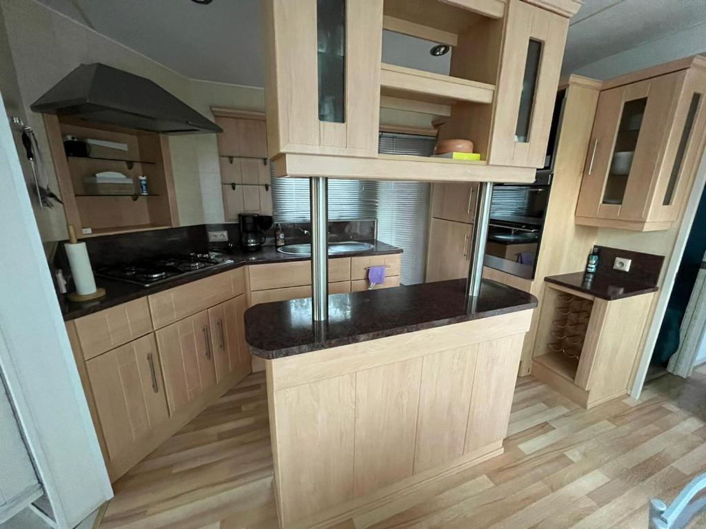 Kuchyň nebo kuchyňský kout v ubytování Mobile home a louer