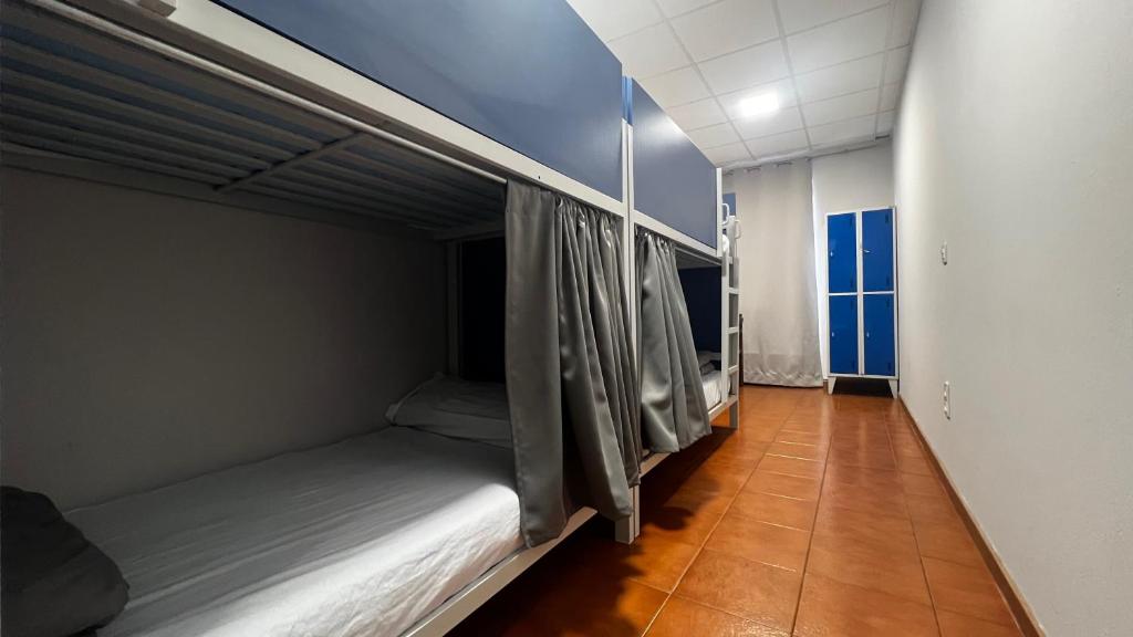 Postel nebo postele na pokoji v ubytování Albergue La Estación