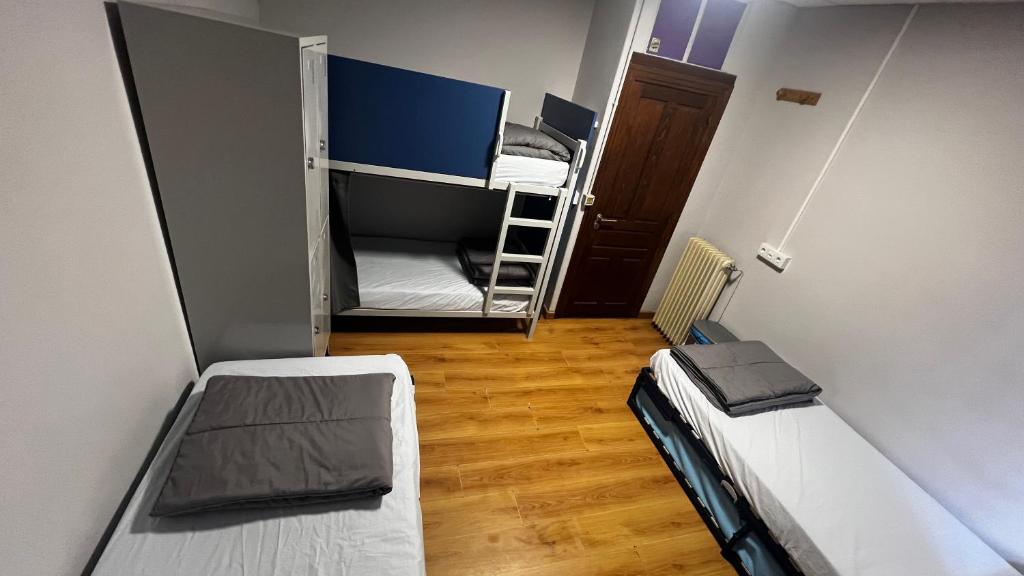 Postel nebo postele na pokoji v ubytování Albergue La Estación
