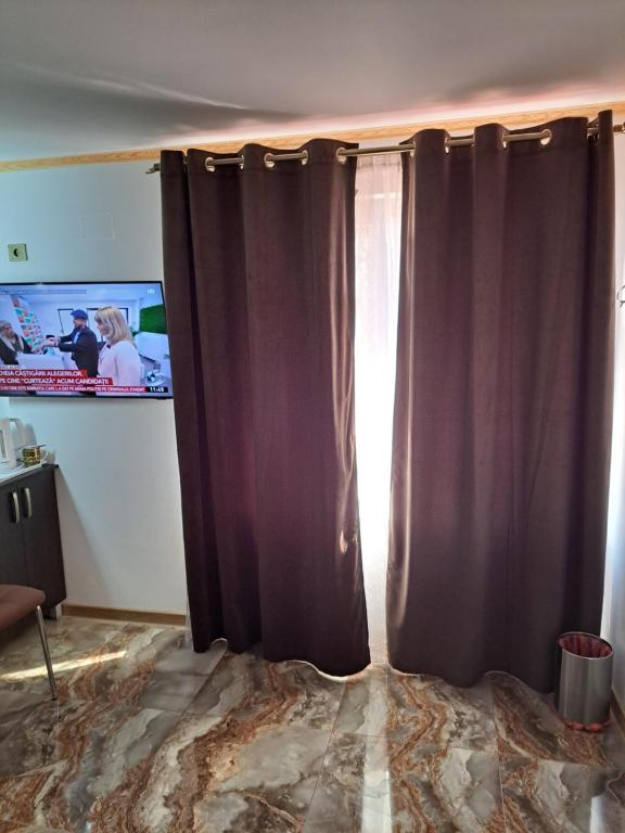 TV a/nebo společenská místnost v ubytování Kallithea