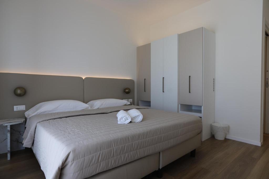 Postel nebo postele na pokoji v ubytování Hotel Concordia