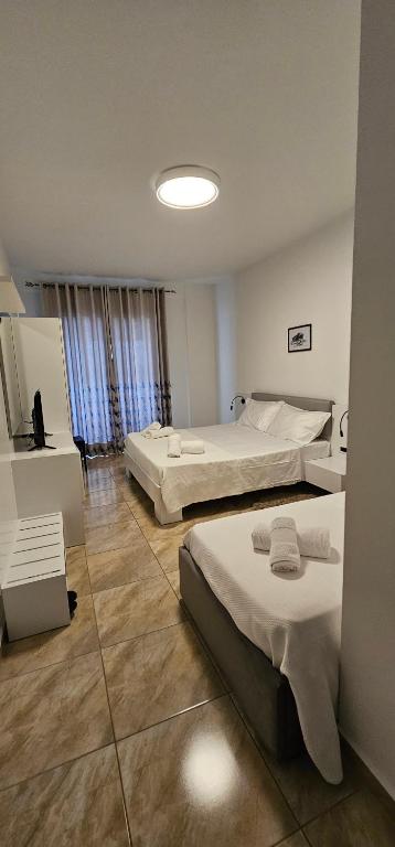 Postel nebo postele na pokoji v ubytování Hotel Pirro
