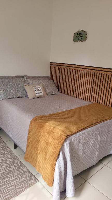 Un pat sau paturi într-o cameră la Loft Individual Aconchegante