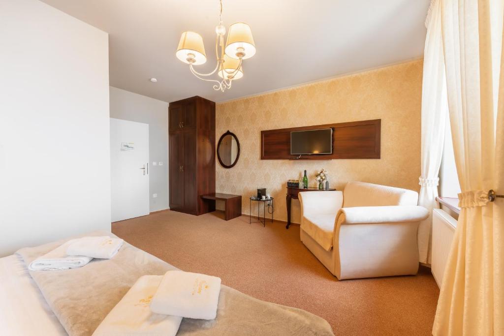 Postel nebo postele na pokoji v ubytování Hotel Plumlov
