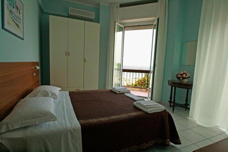 Postel nebo postele na pokoji v ubytování Hotel Acapulco