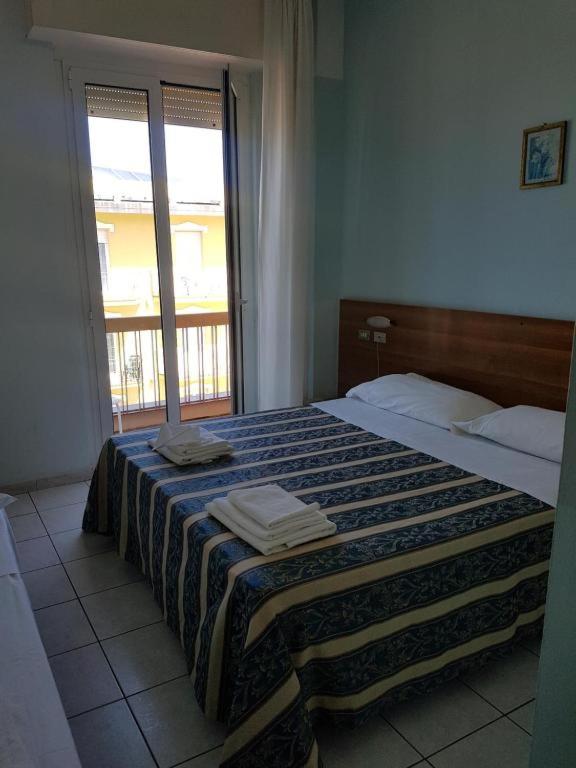 Postel nebo postele na pokoji v ubytování Hotel Acapulco
