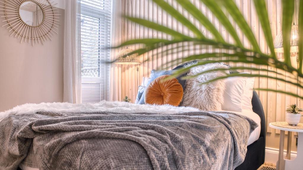 Ένα ή περισσότερα κρεβάτια σε δωμάτιο στο London Hammersmith - hot tub, cinema & gaming room