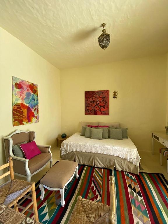 Postel nebo postele na pokoji v ubytování Dar Oueghlani - Maison d'hôtes