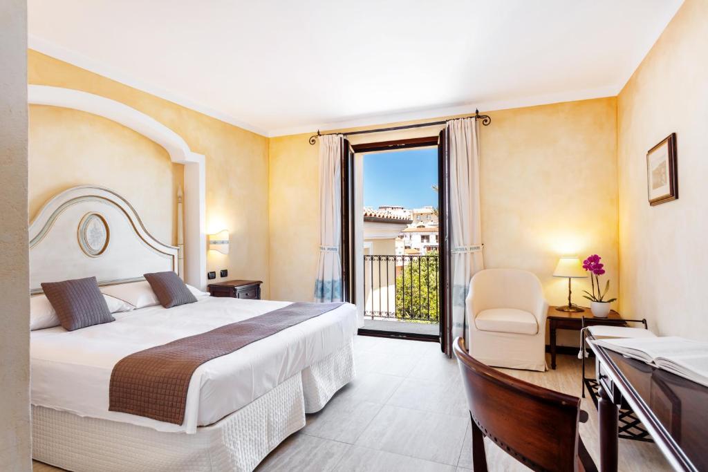 Postel nebo postele na pokoji v ubytování La Vecchia Fonte Boutique Hotel