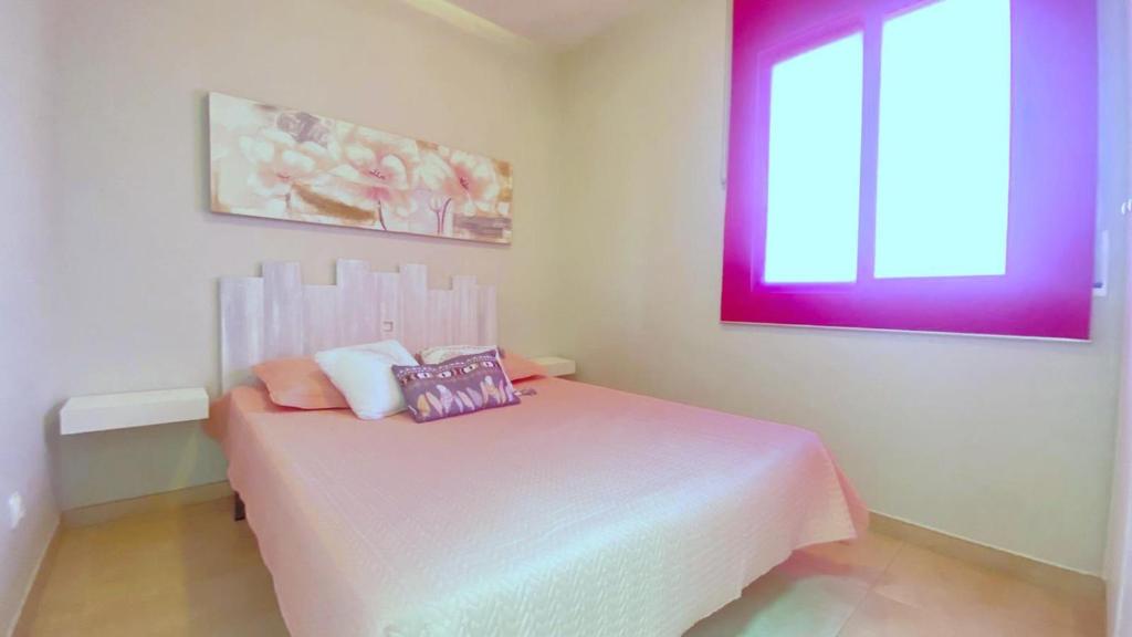 A bed or beds in a room at OLIMPE 2 8