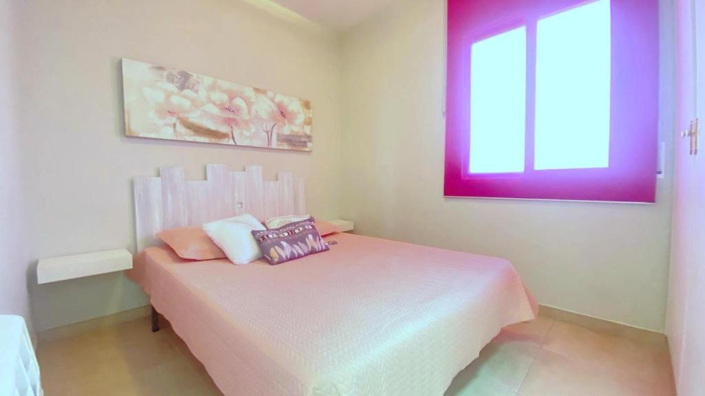A bed or beds in a room at OLIMPE 2 8