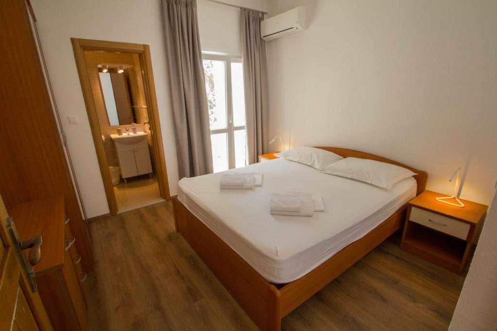 Postel nebo postele na pokoji v ubytování Apartmani Josip