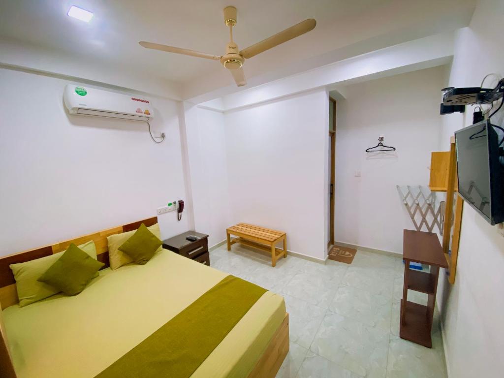 Postel nebo postele na pokoji v ubytování Sparkling Resort Kataragama