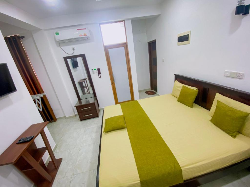 Postel nebo postele na pokoji v ubytování Sparkling Resort Kataragama