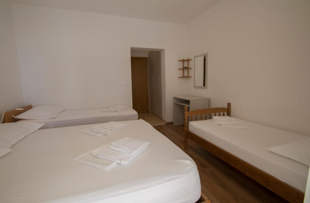Postel nebo postele na pokoji v ubytování Apartmani Josip
