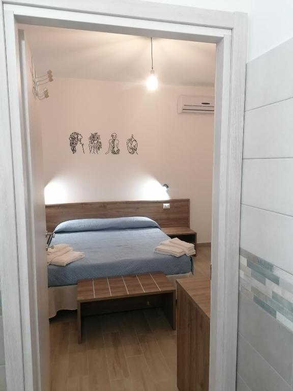 Postel nebo postele na pokoji v ubytování CLASS ROOMS AFFITTACAMERE
