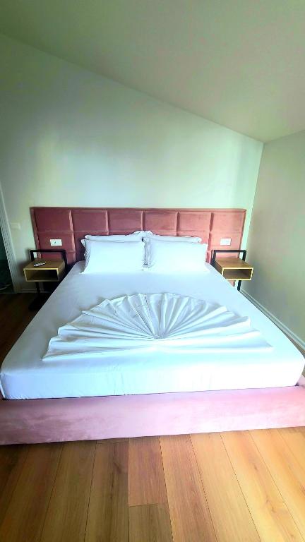 Postel nebo postele na pokoji v ubytování Hotel Noel