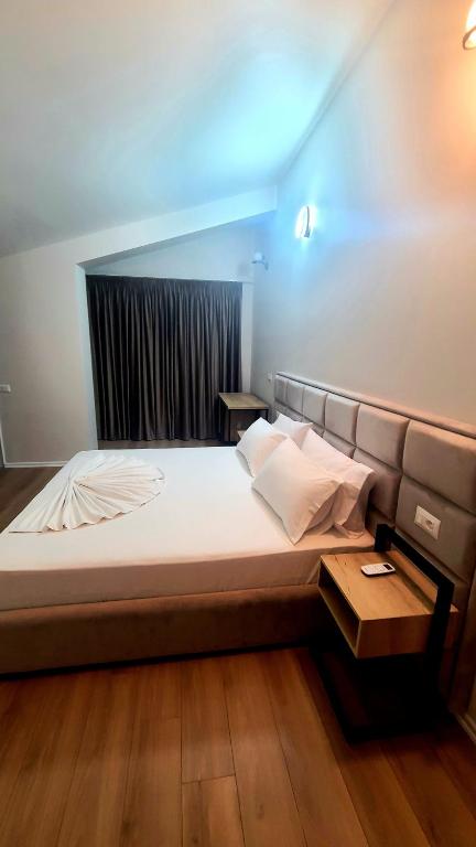 Postel nebo postele na pokoji v ubytování Hotel Noel
