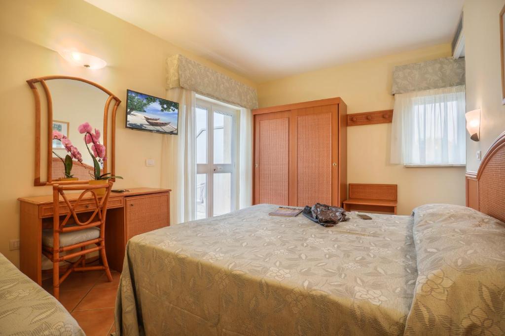 Posteľ alebo postele v izbe v ubytovaní Hotel Katy