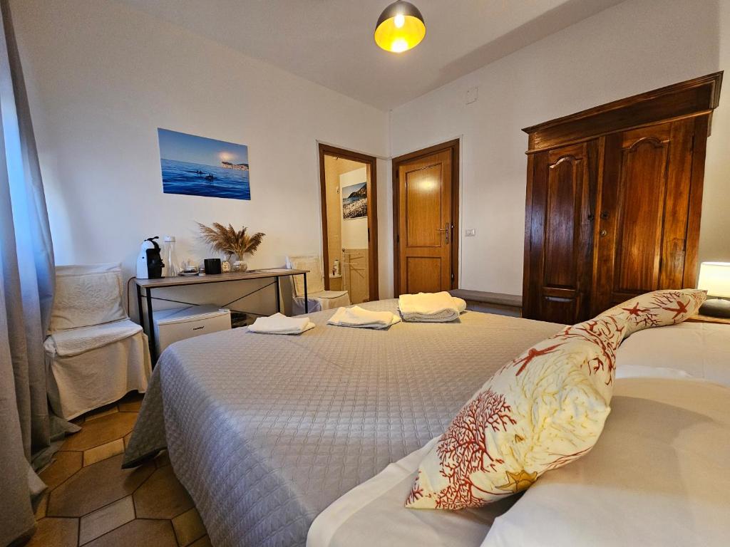 Postel nebo postele na pokoji v ubytování Antonhouse Alghero