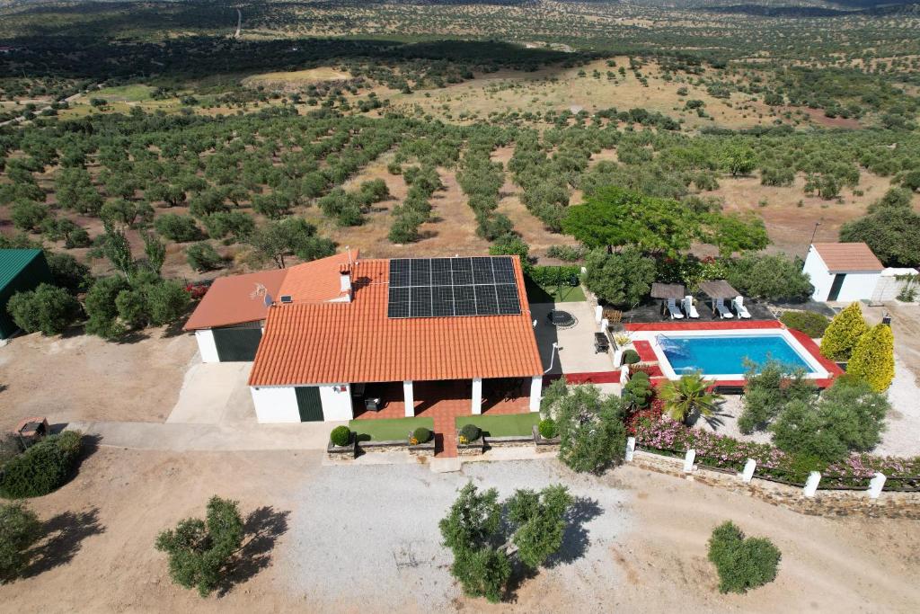 an aerial view of a home with a solar roof at Casa Rural La Loba in Malcocinado