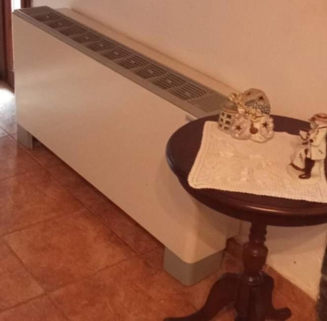 a counter with a stool in front of a wall at house FYNTIKAKH - SKALA in Anopoli Sfakion