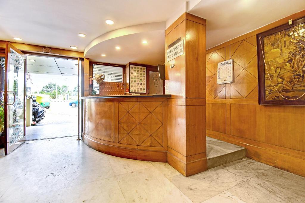 a lobby of a building with a ticket counter at OYO Hotel Star Ldh in Ludhiana
