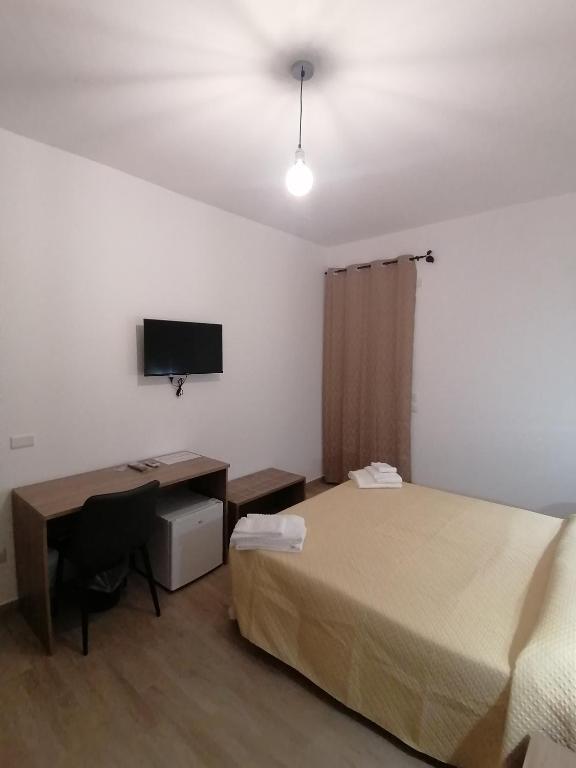 Postel nebo postele na pokoji v ubytování CLASS ROOMS AFFITTACAMERE