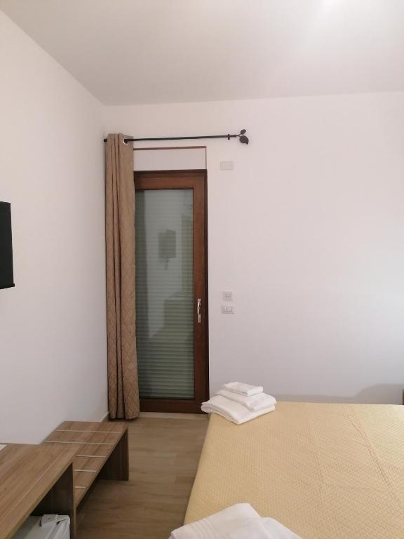 Postel nebo postele na pokoji v ubytování CLASS ROOMS AFFITTACAMERE