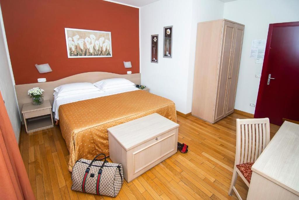 Postel nebo postele na pokoji v ubytování Hotel La Colonna