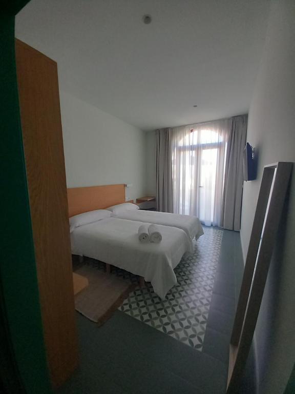 Postel nebo postele na pokoji v ubytování TORREMOCHA