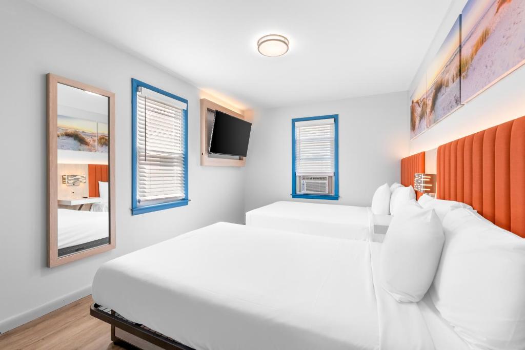 Postel nebo postele na pokoji v ubytování Buttercup Suites Wildwood Crest Beach
