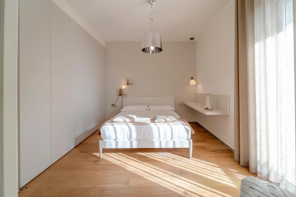 Postel nebo postele na pokoji v ubytování Kalì Tribe Home