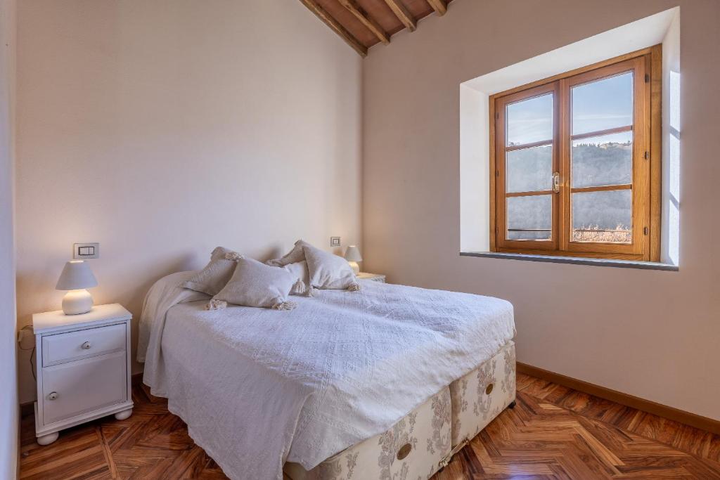 Postel nebo postele na pokoji v ubytování Casa Bachella