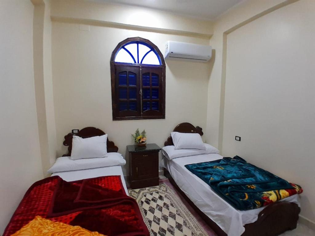 Postel nebo postele na pokoji v ubytování Osiris Guest House