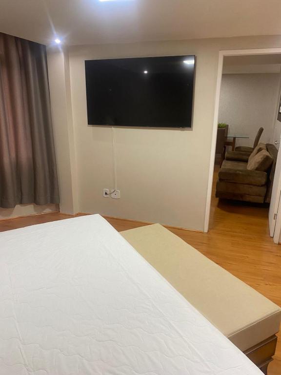Postel nebo postele na pokoji v ubytování Harbor Querência Hotel
