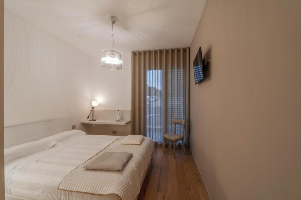 Postel nebo postele na pokoji v ubytování Kalì Tribe Home
