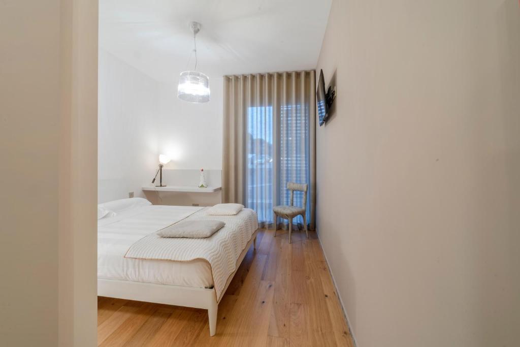 Postel nebo postele na pokoji v ubytování Kalì Tribe Home